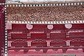 Ladakh - Matho Gompa, projecting roofs in deep red